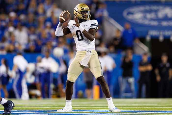 Demarcus Irons Jr. dropping back for a pass in Akron's Week 3 game against Kentucky.